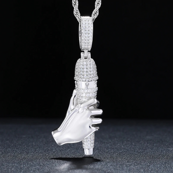 Silver high-heeled shoe pendant with chain on a dark background