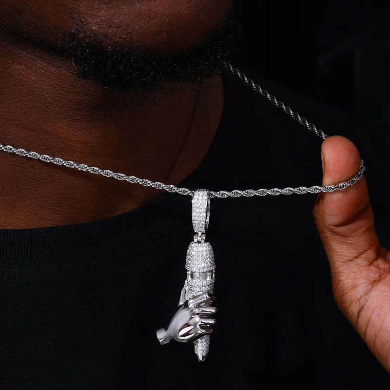 Silver high-heeled shoe pendant with chain on a dark background