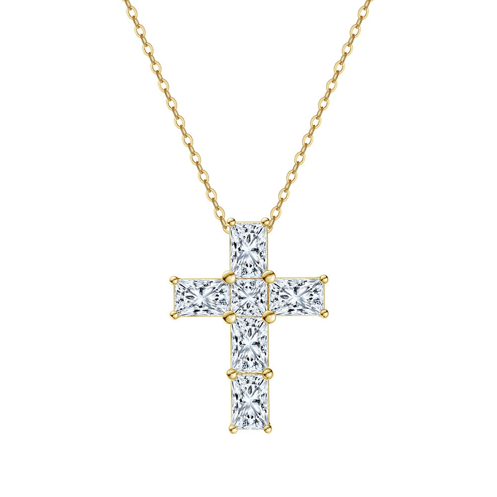 Gold cross pendant necklace with clear stones on a white background