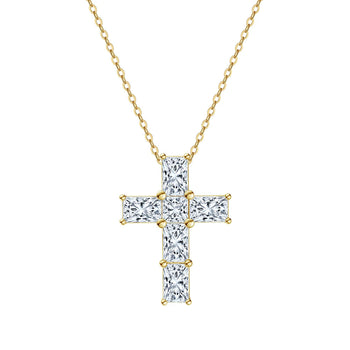 Gold cross pendant necklace with clear stones on a white background