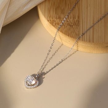 MOISSANITE ROUND BRILLIANT HALO HEART PENDANT IN STERLING SILVER