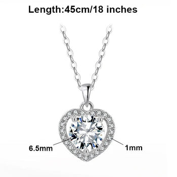 MOISSANITE ROUND BRILLIANT HALO HEART PENDANT IN STERLING SILVER