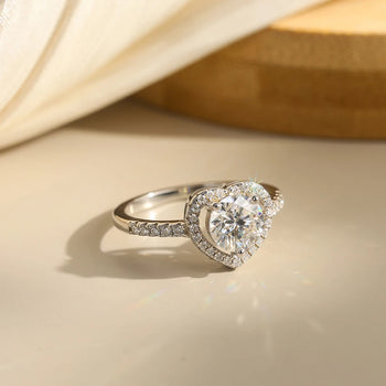MOISSANITE ROUND BRILLIANT HALO HEART RING IN STERLING SILVER