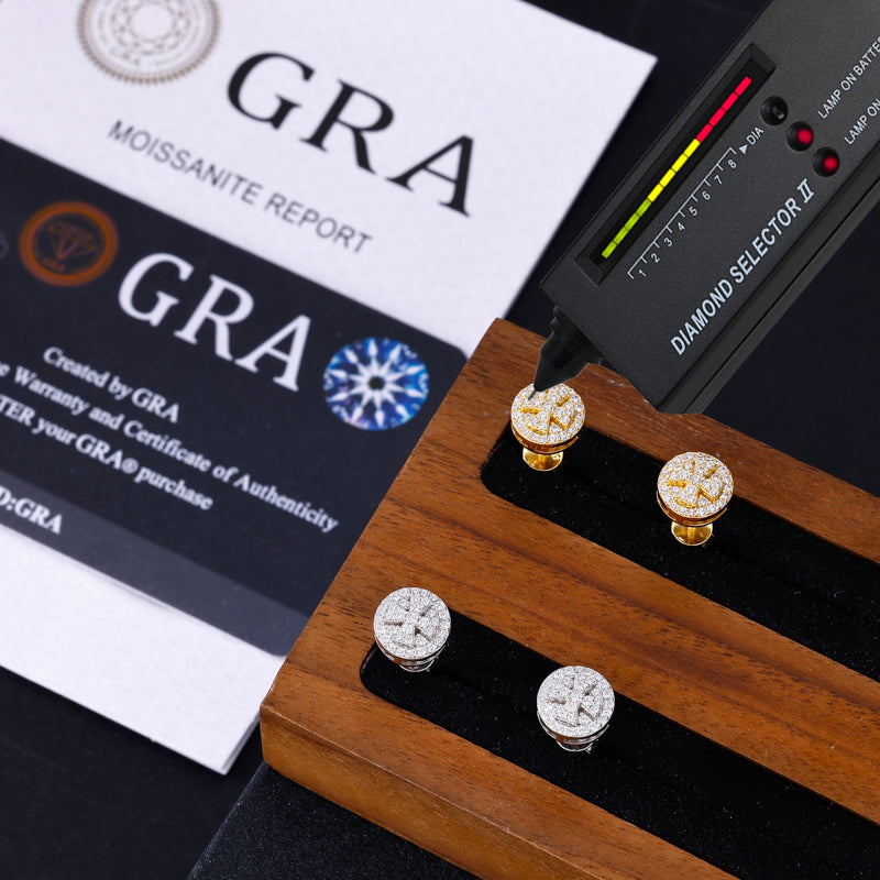 Diamond selector tool with moissanite earrings and GRA certification in the background