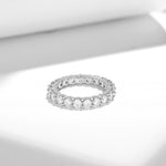 MOISSANITE TENNIS ETERNITY BAND RING WITH SIDE HALO IN STERLING SILVER