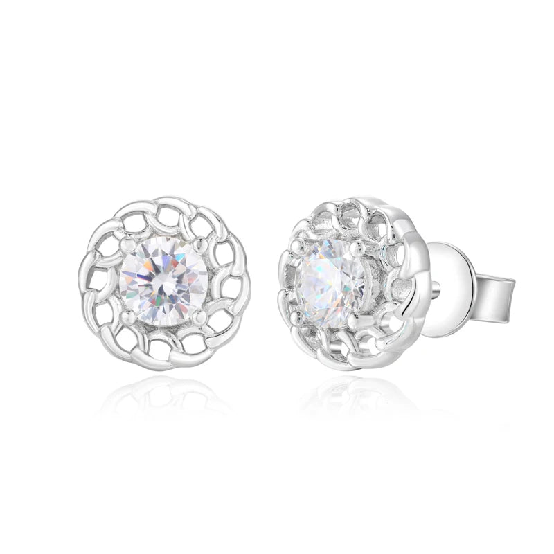 Silver earrings with clear gemstones on a white background