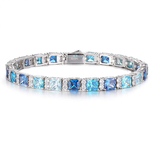 MOISSANITE DIAMOND AND BLUE PRINCESS CUT CZ CLUSTER TENNIS BRACELET IN STERLING SILVER