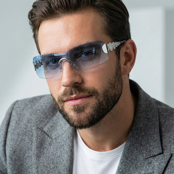 Man wearing futuristic glasses with a neutral background