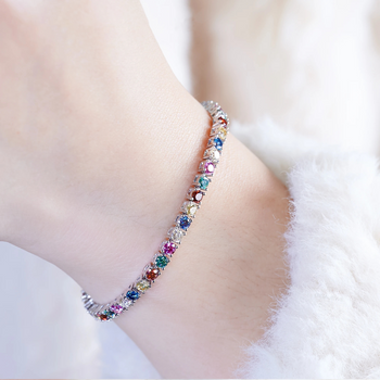 Multicolored beaded bracelet on a person's wrist with a soft background