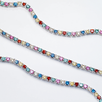 Multicolored gemstone tennis bracelet on a white background