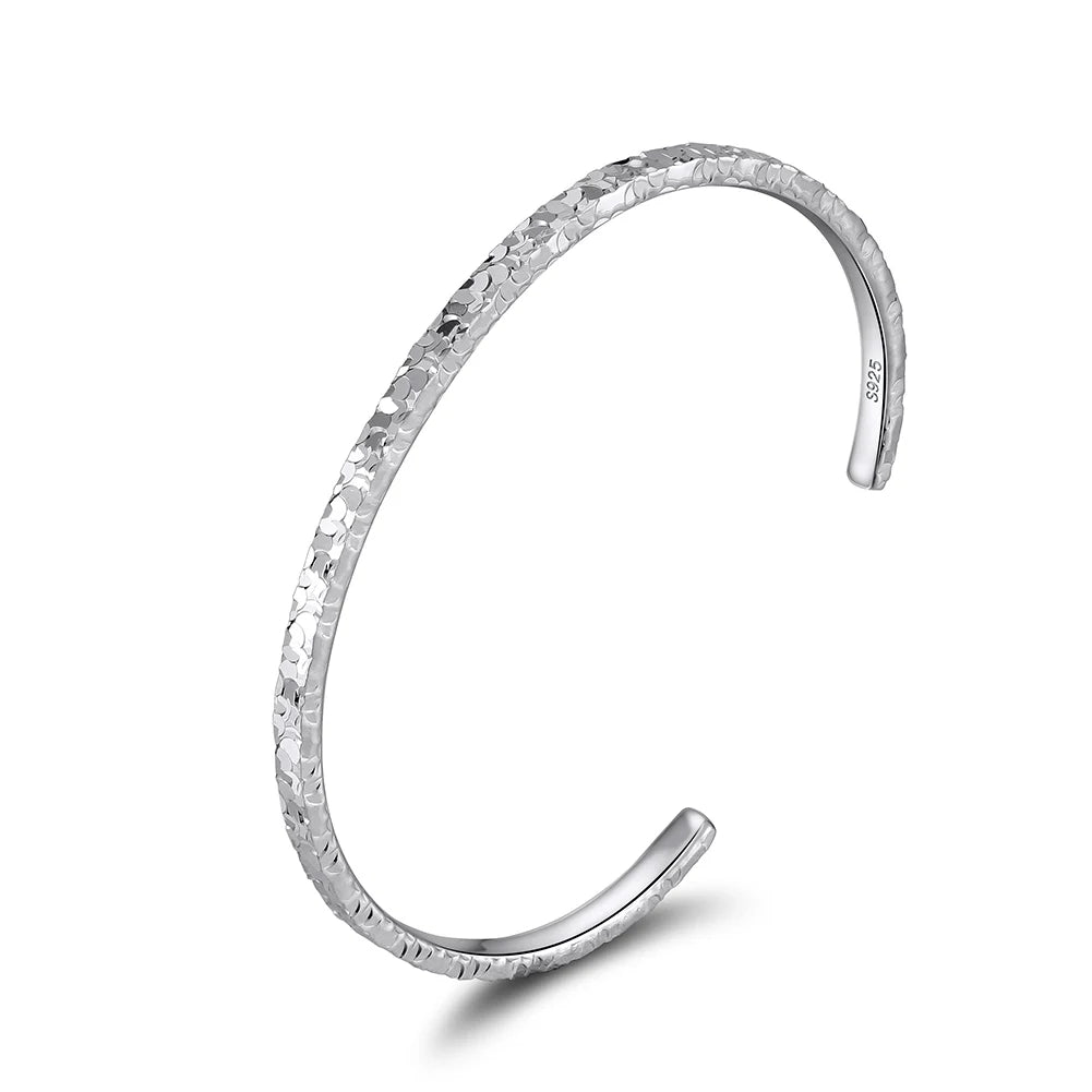 TEXTURED EDGE OPEN BANGLE IN STERLING SILVER