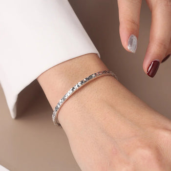 TEXTURED EDGE OPEN BANGLE IN STERLING SILVER