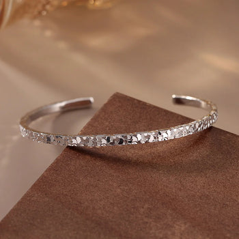 TEXTURED EDGE OPEN BANGLE IN STERLING SILVER