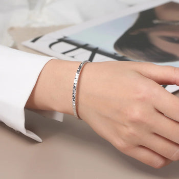 TEXTURED EDGE OPEN BANGLE IN STERLING SILVER