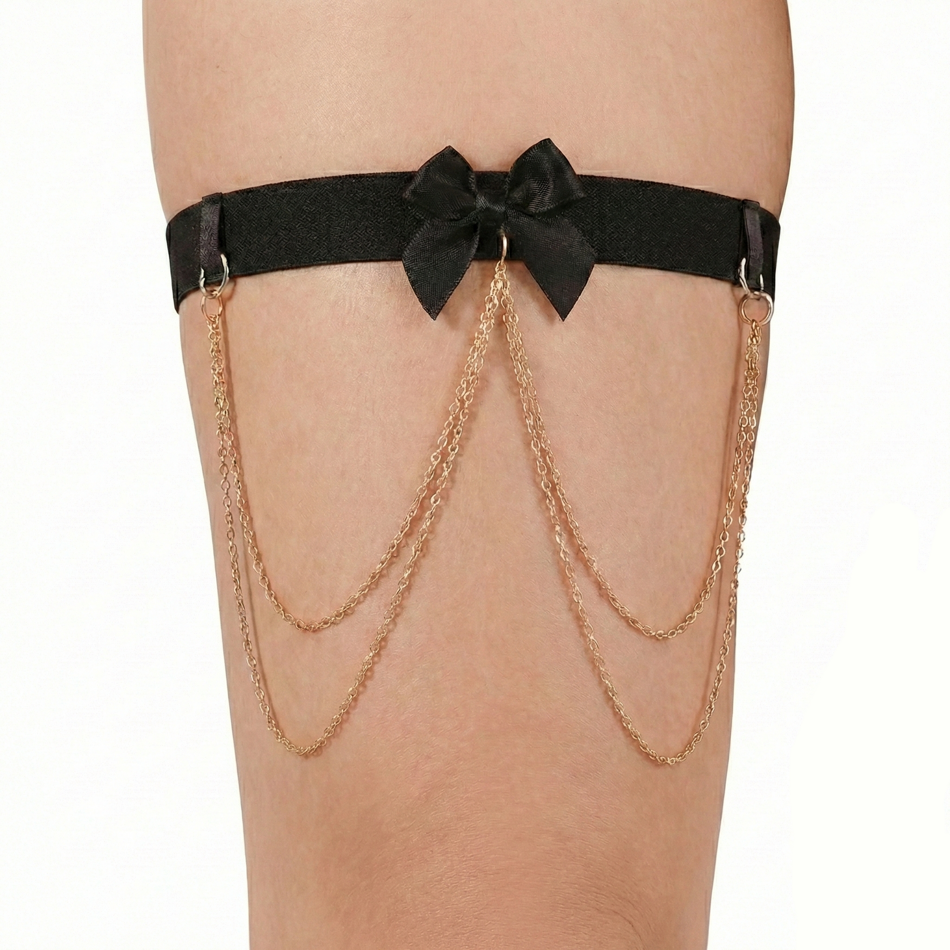 Black garter belt with gold chains on a white background