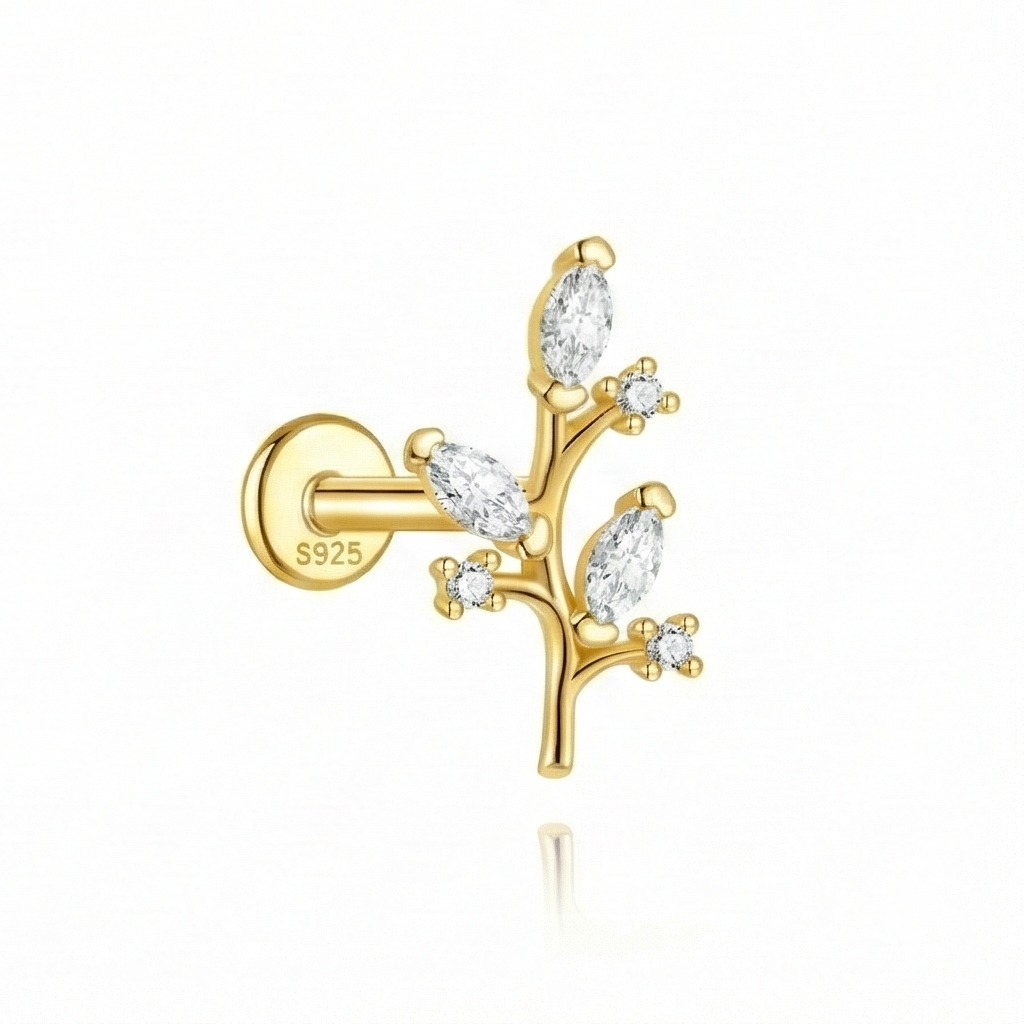 Gold earring with diamond-like stones on a white background