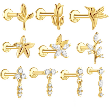 Collection of gold and diamond earrings on a white background