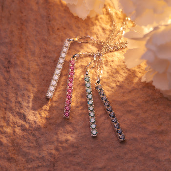 WHITE GOLD PLATED ROUND CUT COLORED MOISSANITE PENDANT IN STERLING SILVER