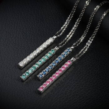 WHITE GOLD PLATED ROUND CUT COLORED MOISSANITE PENDANT IN STERLING SILVER