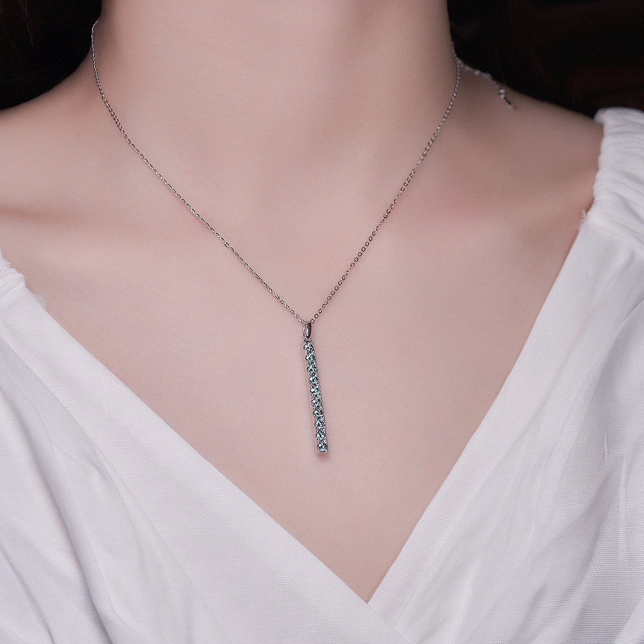 WHITE GOLD PLATED ROUND CUT COLORED MOISSANITE PENDANT IN STERLING SILVER