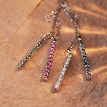 WHITE GOLD PLATED ROUND CUT COLORED MOISSANITE PENDANT IN STERLING SILVER